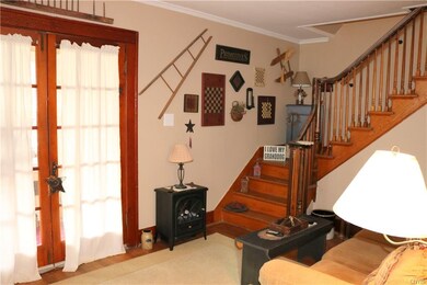 Living room and staircase leading to bedrooms and 