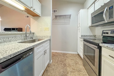 Kitchen with stainless-steel appliances