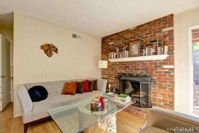 Wood-burning fireplace in living room.