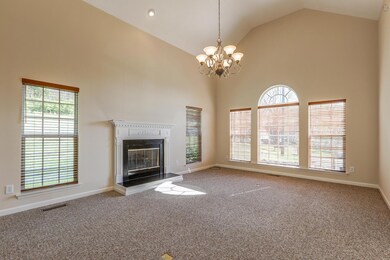 Large Living Room With Fireplace And Vaulted Ceilings
