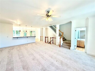 Family Room looking towards the Kitchen and the Guest Powder Room on the right.