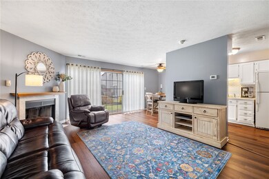 Spacious living area has access to dining room and kitchen.