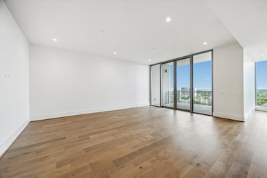 Alternate view of the Living room with wall of sliding glass doors leading to the outdoor terrace