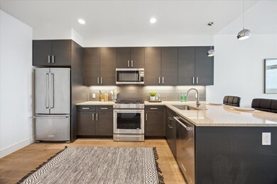 Kitchen featuring stainless steel appliances, a s