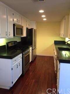 Stainless steel appliances, beautiful hardwood flo
