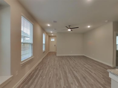 Unfurnished living room featuring recessed lighti