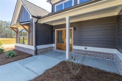 Entrance to property featuring a shingled roof and