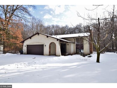 Mediterranean style split level on beautiful lot.