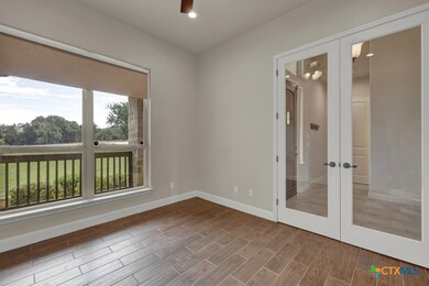 study overlooks front yard and has double French d