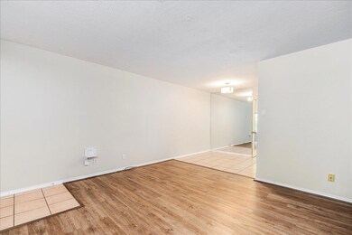Empty room featuring light wood finished floors a