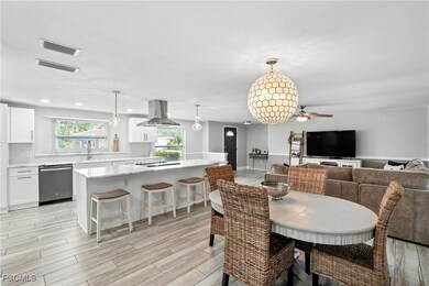 Dining space with light wood finished floors, recessed lighting, and ceiling fan