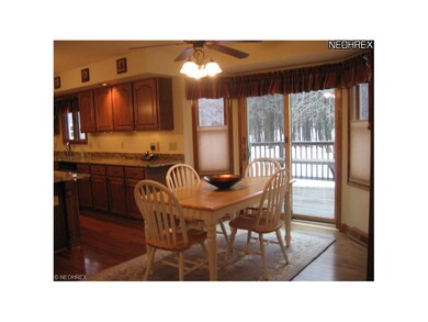 Eat in part of Kitchen with view of deck and  back