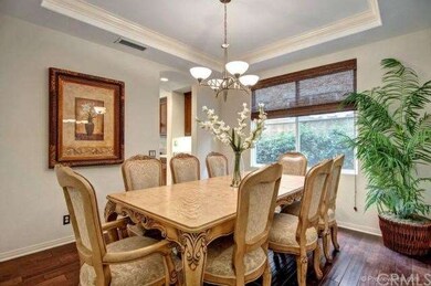 Formal dining room w/modern chandelier, double dee