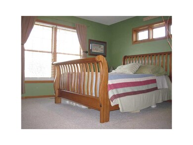 Master Bedroom. Double  window plus transom to all