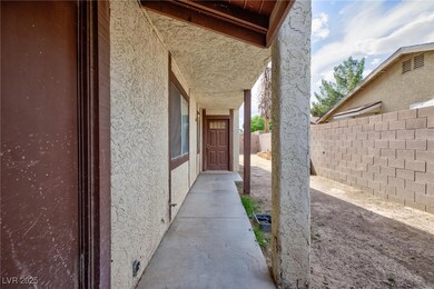 View of side of home featuring stucco siding and f