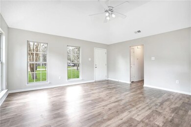 Living Room with vaulted ceiling and high end lami