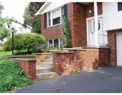 Exterior Front. Notice all the brick retaining wal