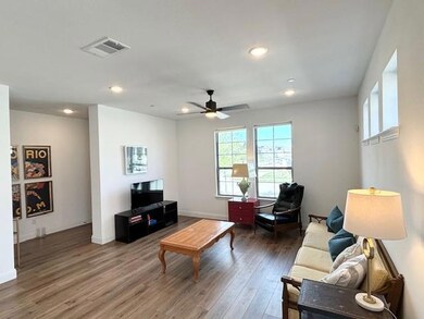 Living room featuring hardwood / wood-style floori