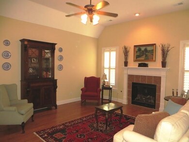 Living Room Features Hardwood, Gas Log Fireplace, 