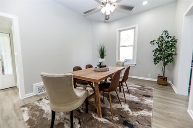 Dining space with wood-type flooring and ceiling fan