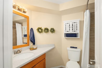 The full bath is centrally located, and directly across from the bedroom. Not shown is a large linen closet in hallway.