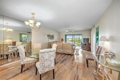 Dining space with ceiling fan with notable chandel