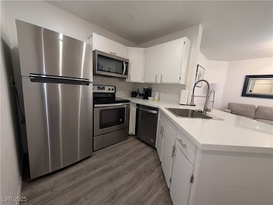 Kitchen featuring appliances with stainless steel