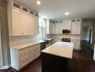 Brand new gourmet kitchen features 3 cm granite an