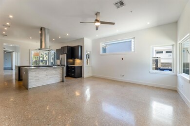 Kitchen with island range hood, stainless steel f
