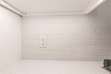 Bathroom with concrete block wall