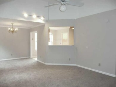 ANOTHER VIEW OF LIVING/DINING COMBO SHOWING PASSTHROUGH FROM LIVING ROOM TO KITCHEN.