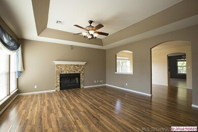 Arched detailing adds elegance to the open floor p