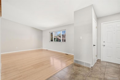 Front entry and living room with vaulted ceilings