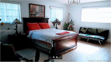 Large master bedroom with his and hers closets als