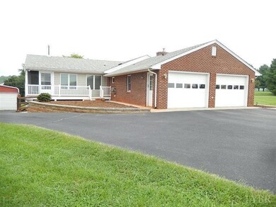 Left side of home showing garage and dcek/screened