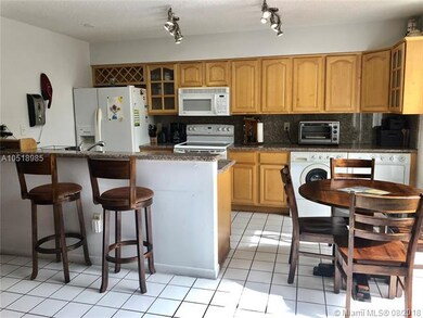 OPEN KITCHEN WITH GRANITE TOP.