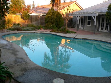 Back yard facing south, pool, patio off of master 