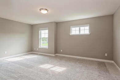 Large primary suite with private bathroom and walk in closet!  *Photos are of another home, colors and finishes may vary.