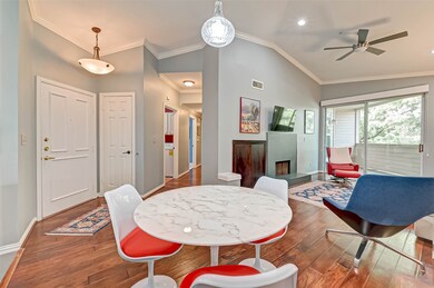 The unit opens to the dining and living areas. The hallway leads you to the convenient half bath and bedrooms.