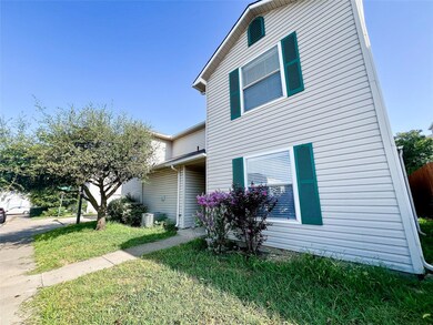 View of side of property featuring a lawn and cent