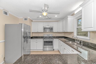 Kitchen with appliances with stainless steel finis