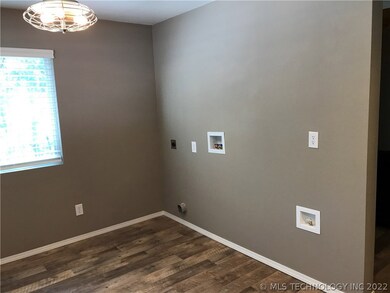 The laundry is in the kitchen area. There is room