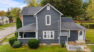 Back of house featuring a yard