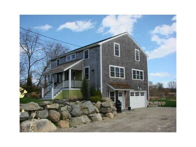 Exterior Front. Over sized 1.5 car garage utility
