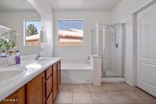 Roman tub, shower and dual sinks.