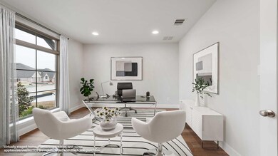 Office space with visible vents, plenty of natural