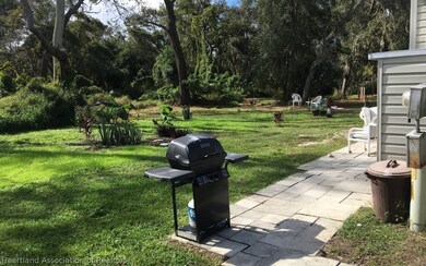 Nice back area and view for this mobile home.