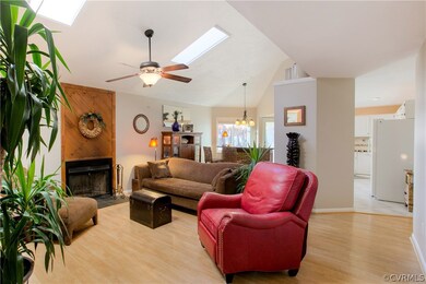 Living room with vaulted ceilings, wood burning fi