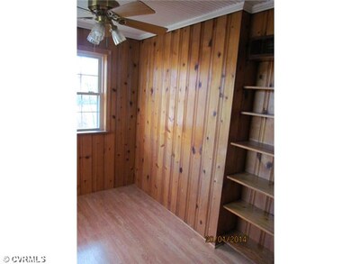 Breakfast Nook - Partial view of large paneled breakfast room with shelving and new laminate wood floor