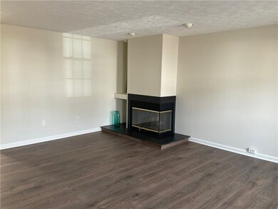 THE LIVING AREA IS LARGE WITH A GAS FIREPLACE,  AD